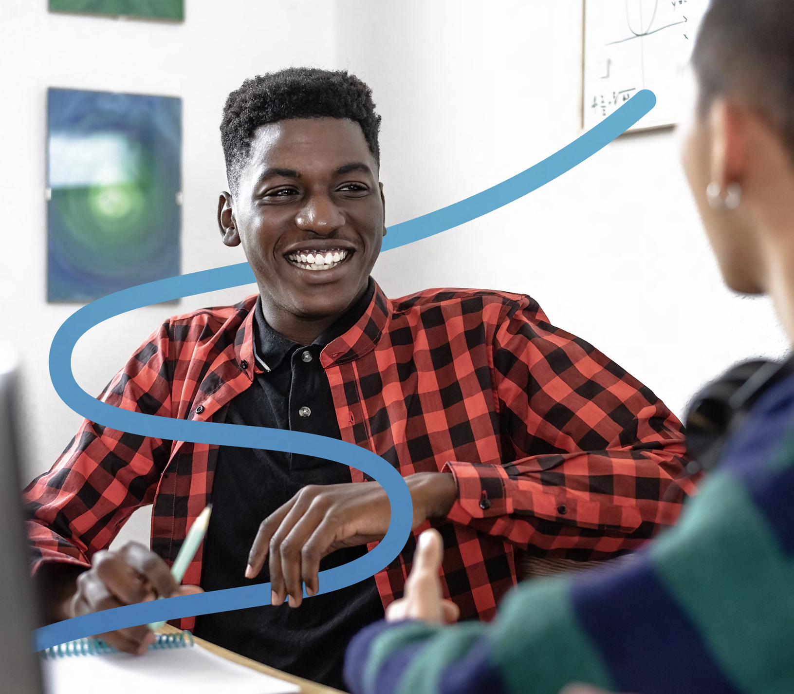 Student smiling during a mentorship conversation